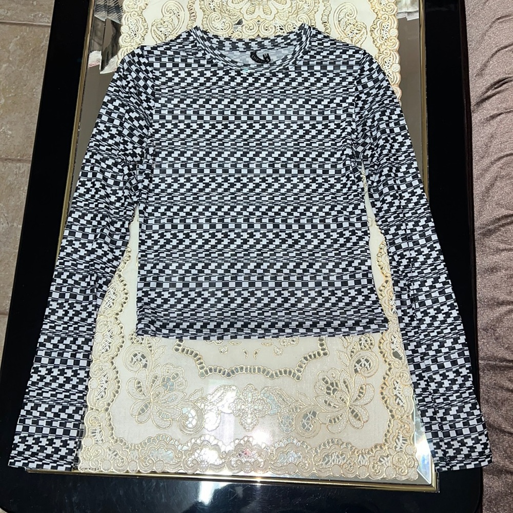 Empyre black and white long-sleeve mesh top with psychedelic houndstooth print